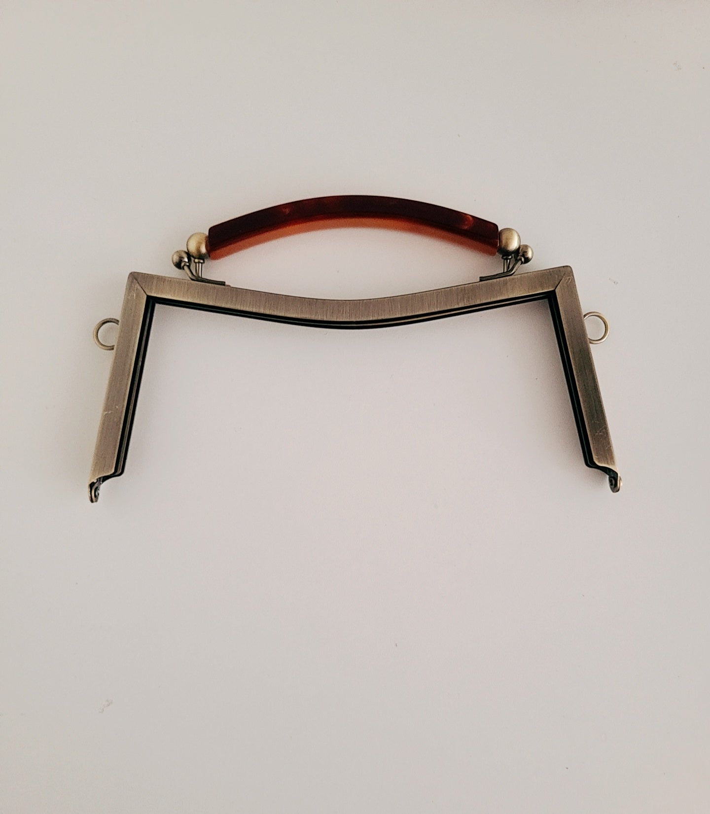 Clasp metal frame for bag making