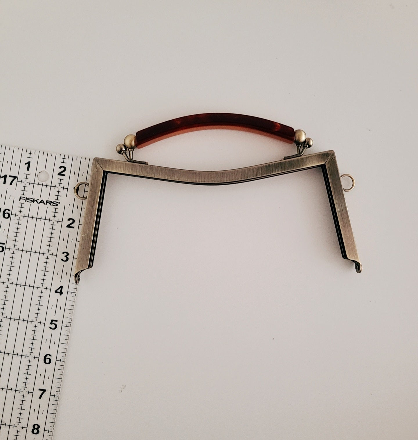 Clasp metal frame for bag making