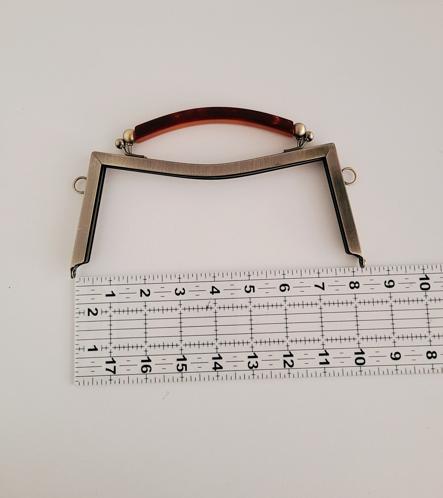 Clasp metal frame for bag making